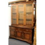 A dark mahogany glazed bookcase, W. 133cm x H. 198cm.