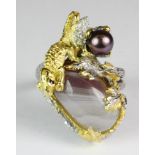 A Hana Maae designer 925 silver gilt ring set depicting a chameleon climbing over a cabochon cut