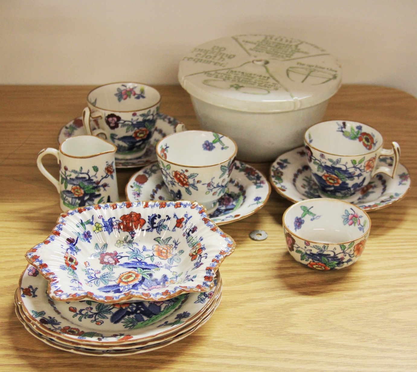 A small quantity of Booths "Pompadour" tea china, together with a Grimwades patent pudding bowl.