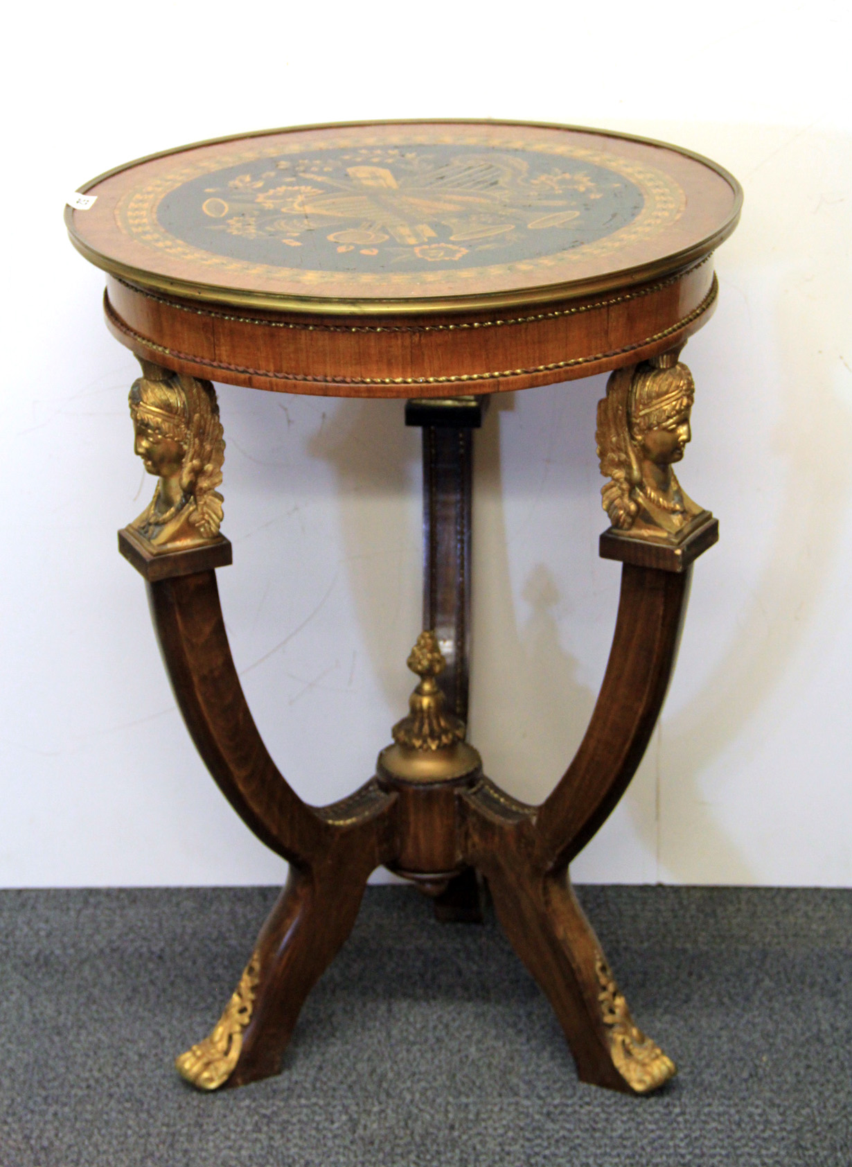 A French ormolu mounted and burr veneered mahogany table with painted decoration to top simulating