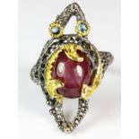 A Hana Maae designer 925 silver gilt ring set with a lovely cabochon cut star ruby and blue topaz (