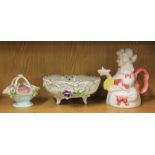 A 19th century German porcelain basket, a porcelain fruit bowl and a character teapot.