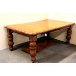 A heavily carved 19th century oak windout dining table, W. 118cm, extending with two leaves from
