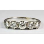 An stunning white metal (tested 18ct gold) five diamond set ring, approx 1.5ct diamnds (T). Est. £