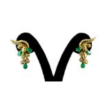 A matching pair of 18ct yellow gold (tested) earrings set with pear cut emeralds and brilliant cut