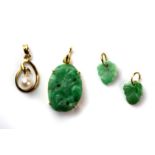 Three 14ct yellow gold (stamped 14k) mounted jade pieces together with a 14ct yellow gold and