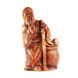 A superbly carved Chinese hardstone figure of a sage stroking his beard, H. 12cm. Est. £200 - 250.