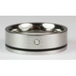 A gentleman's stone set titanium ring (X).