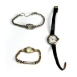 A 9ct gold ladies Longines wristwatch on a gold-plated strap together with two silver ladies