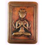 A Tibetan stamped copper ink box featuring a four armed seated Tara, 4 x 6 x 1cm.