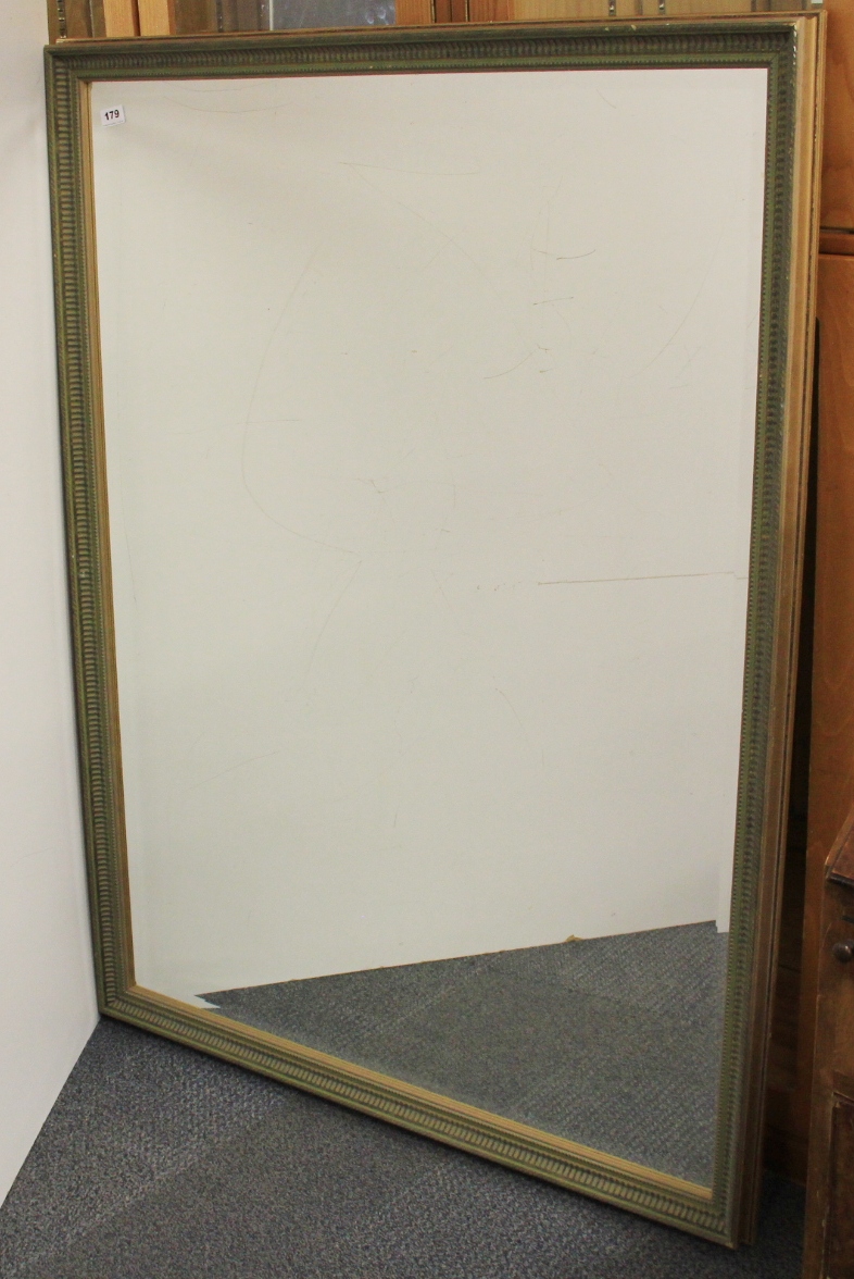 A large framed bevelled mirror, 100 x 130cm.