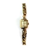 A lady's vintage 9ct gold Omega cocktail watch on a gold plated strap with two extra links.