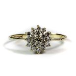 A 9ct yellow gold cubic zirconia set cluster ring (N.5).