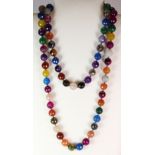 A long polished facetted stone bead necklace. 120 cms