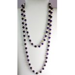 A cultured pearl and polished amethyst bead necklace.