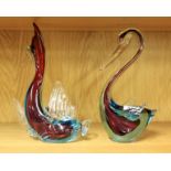 Two red and blue Murano glass ornaments, one in the form of a dolphin; the other a duck, both 27cm