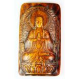 A lovely Tibetan carved yak bone amulet of the seated Buddha, H. 8.5cm.