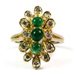A matching 18ct yellow gold ring set with cabochon cut emeralds and brilliant cut diamonds (very