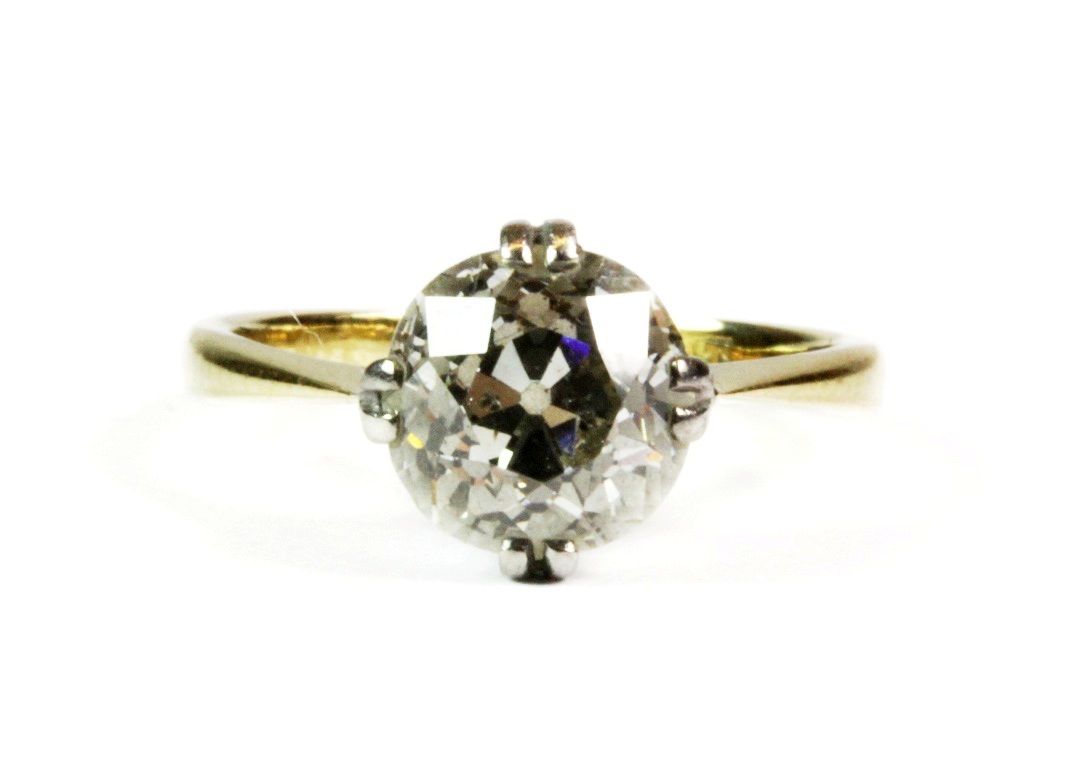 An antique 18ct yellow gold and platinum old cut diamond solitaire ring (H). Approximately 1.60ct.