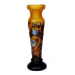 An Emile Galle style orange glass vase, of tapering form, raised on circular foot, with applied blue