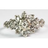 An 18ct white gold (stamped 18ct) diamond set cluster ring.