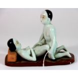 A Chinese painted erotic porcelain figural group, L. 17cm