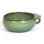 A Chinese celadon crackle glaze pottery tasting bowl, with handle, L. 10cm