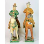 Two Tang style glazed pottery horses and riders, the riders with detachable heads, H. 42cm