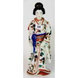 An early 20th century Japanese porcelain figure of a geisha, (A/F), H. 35cm.