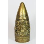 An early 20th century Chinese brass military shell, hammered with flying dragons and a Chinese