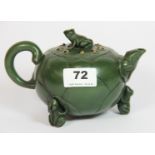 A Chinese green terracotta Ying Xing teapot, the globular body in the form of a lilly pad and the