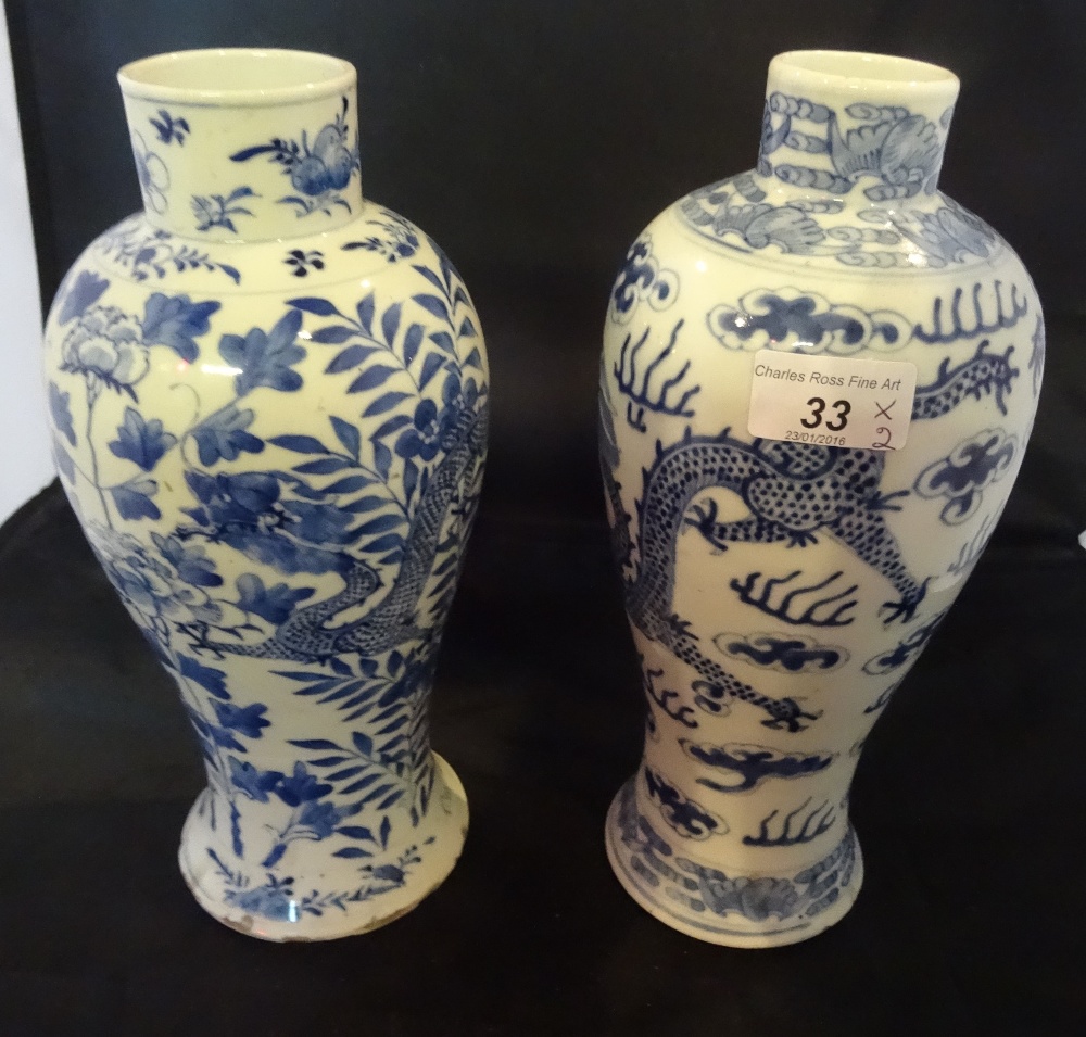 Two 19th century or later Chinese baluster vases, one having dragon amongst clouds and the other