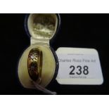 An 18ct gold ring, inset with three circular diamonds. Condition Report: 3.1g