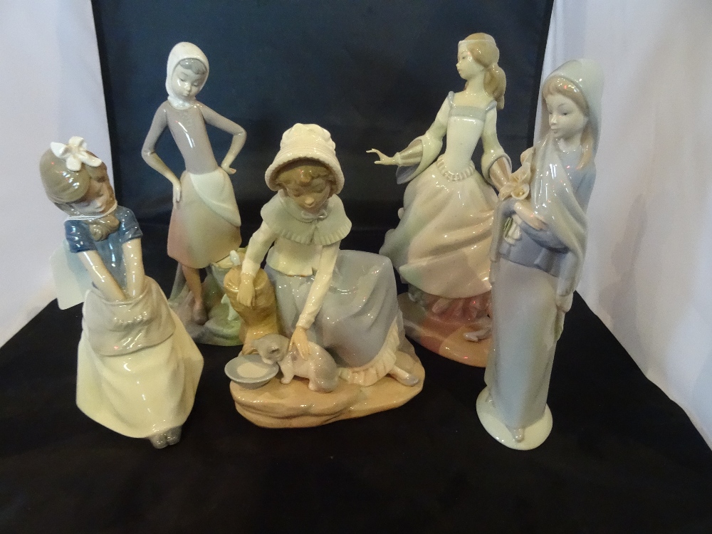 A collection of five figurines, to include: three Lladro and two Nao examples.