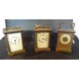 A collection of three brass cased carriage clocks, two having Roman numeral dials,