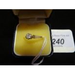 An 18ct yellow gold ring, set with solitaire diamond in a claw mount.