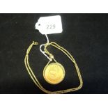 A 1974 krugerrand on a 9ct gold chain and mount, total weight 49.5 grams.