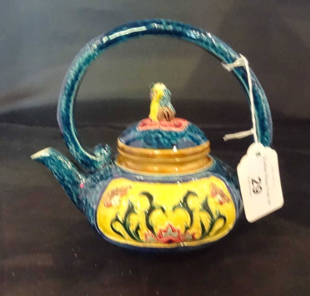 A Taiwan-Cochin ceramic teapot, an elaborately decorated in the Majolica style,