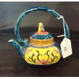 A Taiwan-Cochin ceramic teapot, an elaborately decorated in the Majolica style,