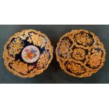 A pair of near matching early 20th century Meissen gilt decorated bowls, on a cobalt blue ground,