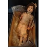 A 20th century Max Oscar Arnold bisque headed doll, having sleeping blue eyes,