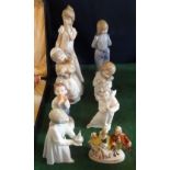 Eight ceramic figurines to include: Lladro, Nao and other examples.