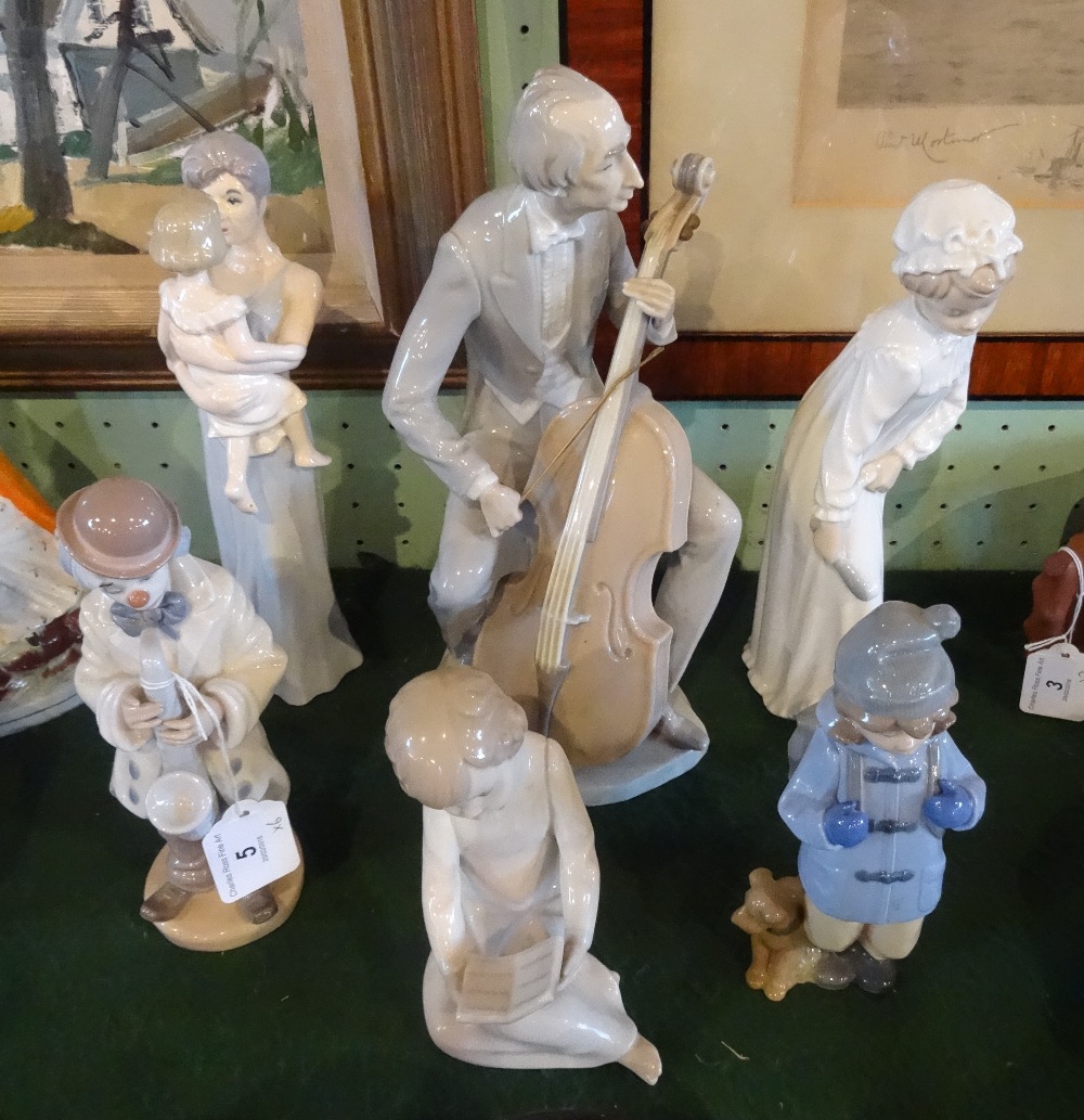 A Lladro Cellist figurine, together with five other similar figurines.