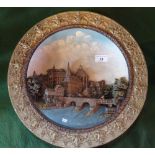 A W F & S Marburg circular wall plaque, having relief decoration with a gilt border (40cm diameter).