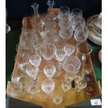 A large quantity of glassware, to include: a pair of spirit decanters, cut glass wine glasses,