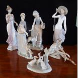 A collection of four Lladro and two Nao figurines, to include examples numbered 6366 & 5682.