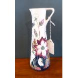 A Moorcroft tall jug in the Bramble revisited pattern, impressed and painted marks to base (19cm).