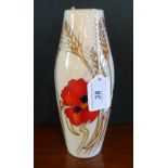 A Moorcroft Harvest Poppy vase, the tube lined decoration on a cream ground,