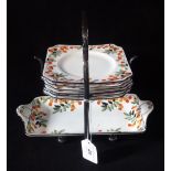 A Royal Doulton sandwich set, numbered H4012, having stylized circular fruits on a white ground,