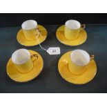 A set of four Wedgwood coffee cans and saucers, numbered 5164,